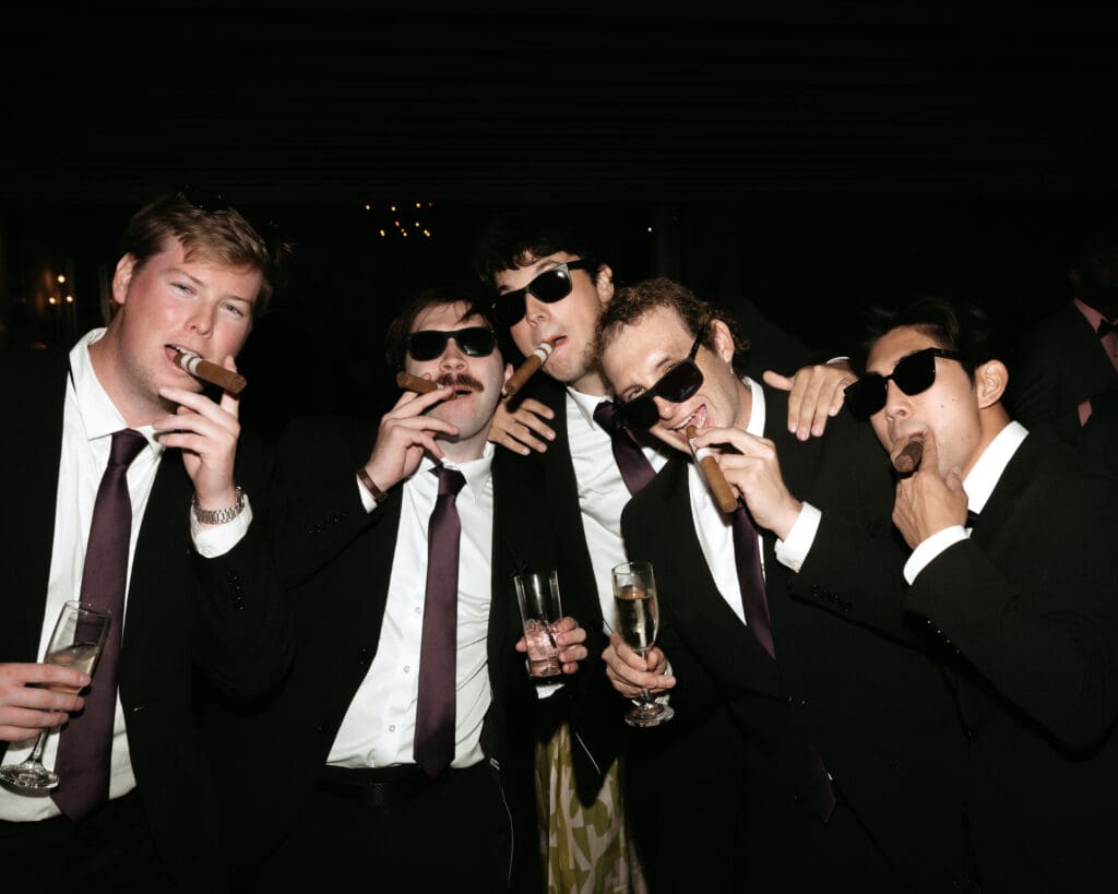 Direct flash photo during wedding reception - groomsment